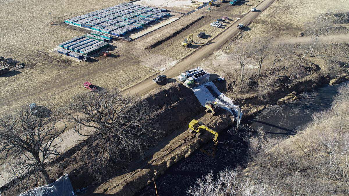 Crews from Canadian pipeline operator TC Energy work to remediate the site of a December oil spill from the Keystone Pipeline in northern Kansas on Friday, Dec. 30, 2022.