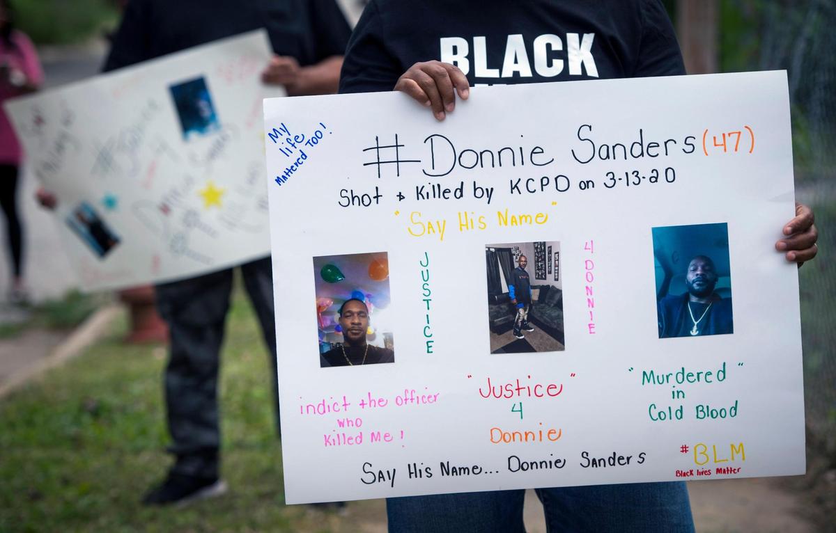 The family of Donnie Sanders, including sister, Youlanda Sanders, held posters as they gathered to talk about police brutality and seeking justice for Donnie, 47, who died after being shot by a Kansas City police officer. Donnie, who fled on foot after an attempted traffic stop, was fatally shot near E. 52nd Street and Wabash Avenue on March 12, 2020, in Kansas City. He was unarmed.
