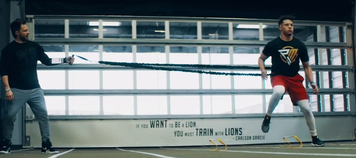 Chiefs quarterback Patrick Mahomes works out during a session with trainer Bobby Stroupe at the APEC training center in Ft. Worth.