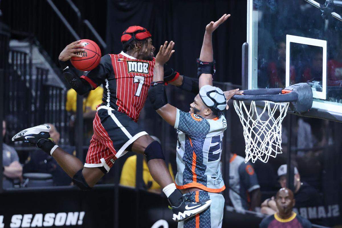 Darius Clark of Mob goes up to dunk over Tyquan Scott of Buzzsaw at the Cox Pavilion on July 23, 2023 in Las Vegas, Nevada.
