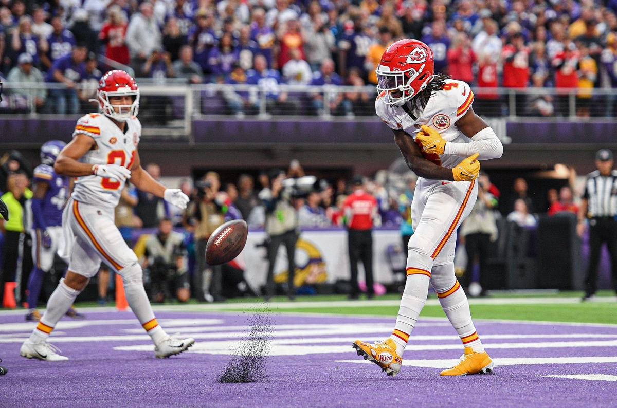 Kansas City Chiefs wide receiver Rashee Rice (4) spikes the ball after scoring on a reception against the Minnesota Vikings in the third quarter Sunday, October. 8, 2023, at U.S, Bank Stadium in Minneapolis, Minn.