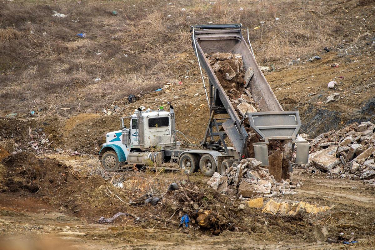 An industrial truck unloads concrete material at the Flat Land Excavating landfill on March 23 in Easton, Kansas.
