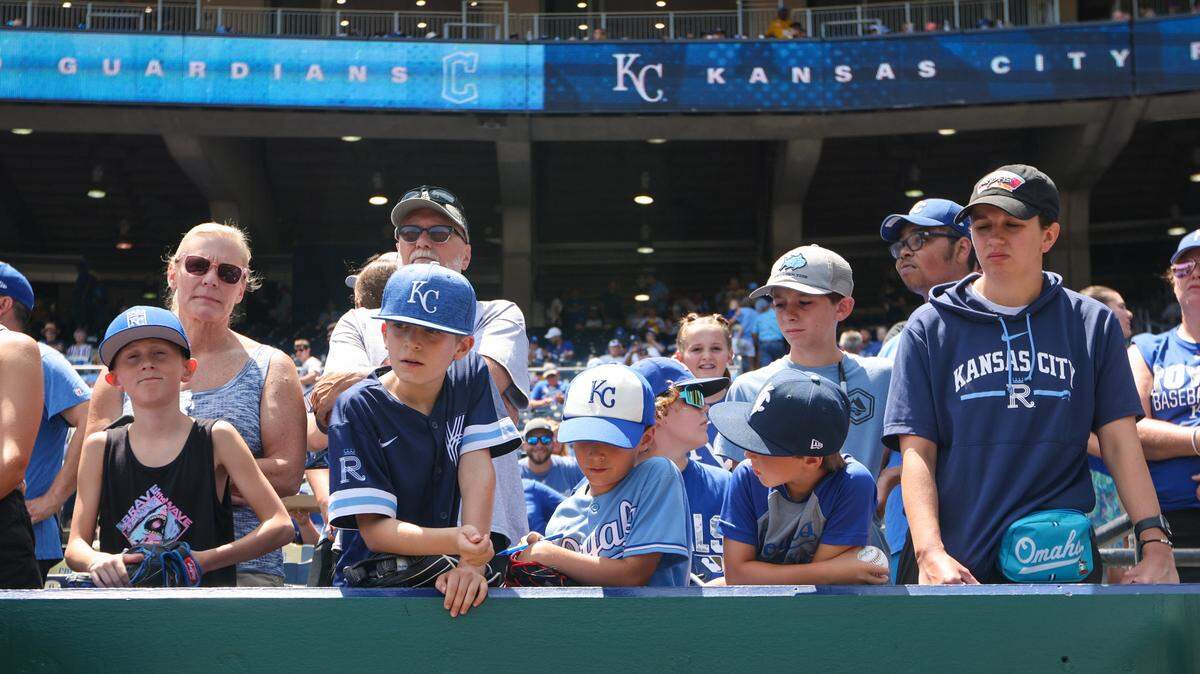 Young fans wait for autographs prior to the game between the Kansas City Royals and the Cleveland Guardians at Kauffman Stadium on June 30, 2024.