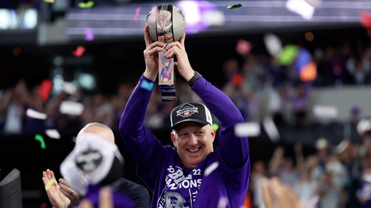Kansas State Wildcats head coach Chris Klieman holds up the Big 12 Championship trophy after the game against the TCU Horned Frogs at AT&T Stadium on Dec. 3, 2022.