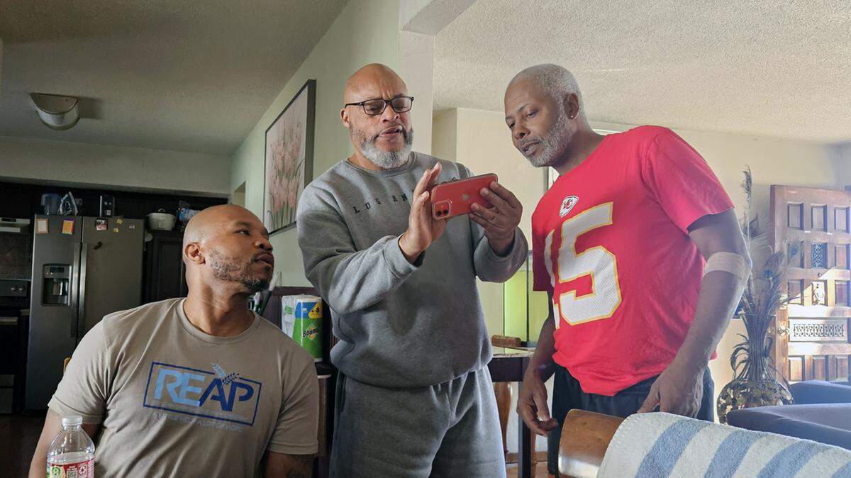 From left, former UMKC Hall of Fame basketball player Michael Watson, former AAU coach Myron Piggie and Marcus Walker, Sr., Piggie’s former grade school basketball teammate