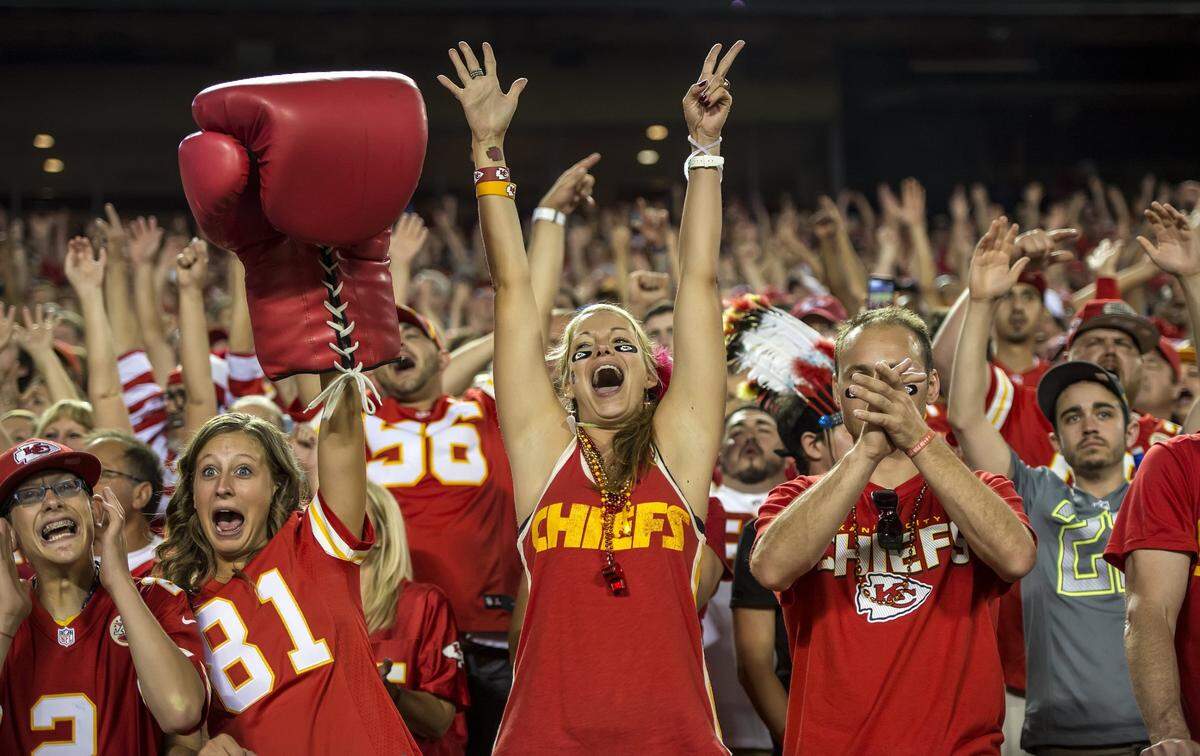 Kansas City Chiefs fans celebrated a touchdown by Kansas City Chiefs tight end Travis Kelce in the 41-14 win over the New England Patriots at Arrowhead Stadium in Kansas City, Mo. on Monday night, September 29, 2014.