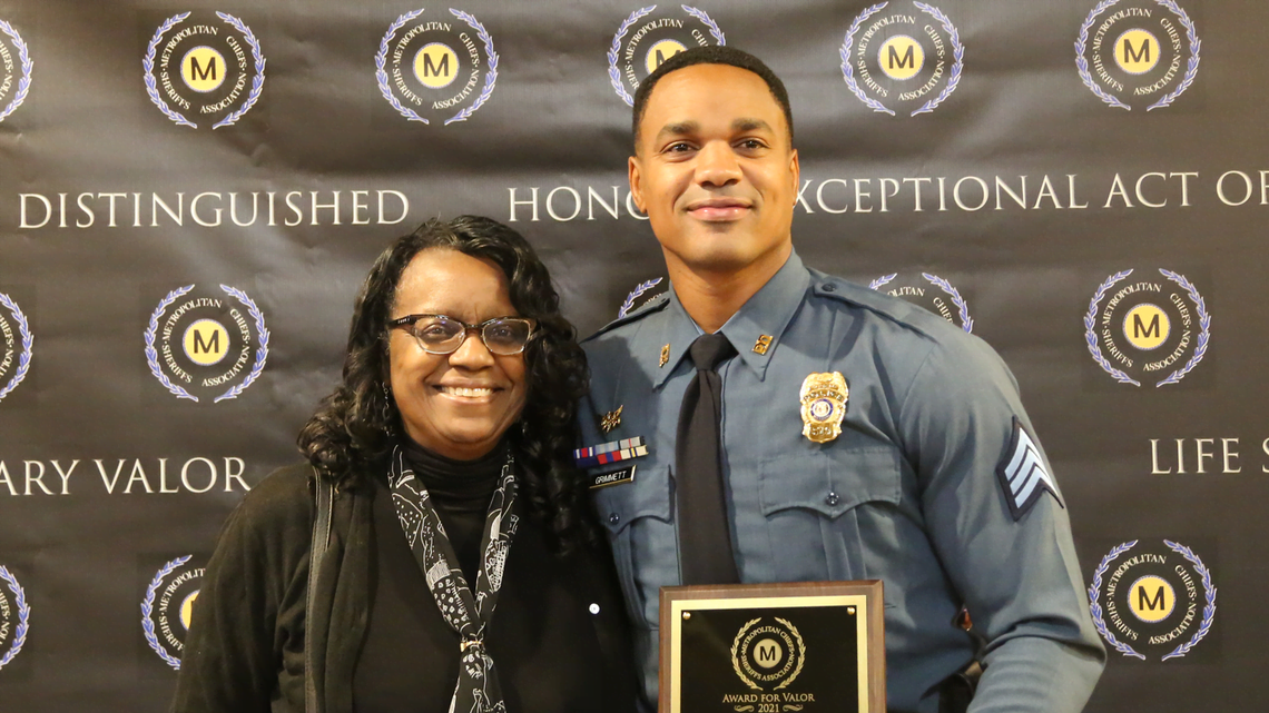 Kansas City Police Department Sgt. Terry Grimmett shown receiving a Gold Award for Valor.
