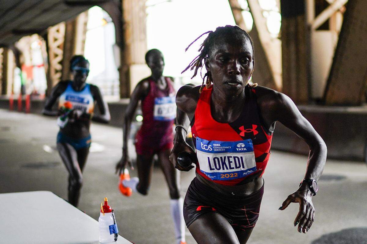 Sharon Lokedi, of Kenya, crosses the Ed Koch Queensboro Bridge during the New York City Marathon in New York Sunday.