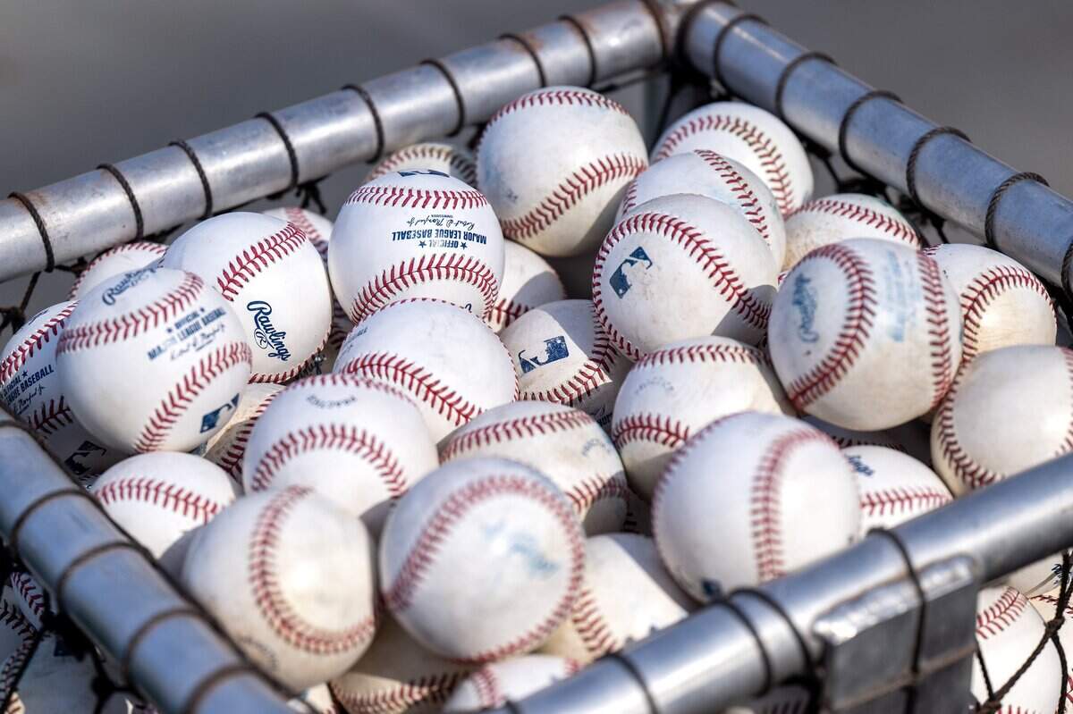 Baseballs fill a basket during batting practice before a game between the Kansas City Royals and Houston Astros on Friday, June 12, 2026, at Kauffman Stadium in Kansas City.