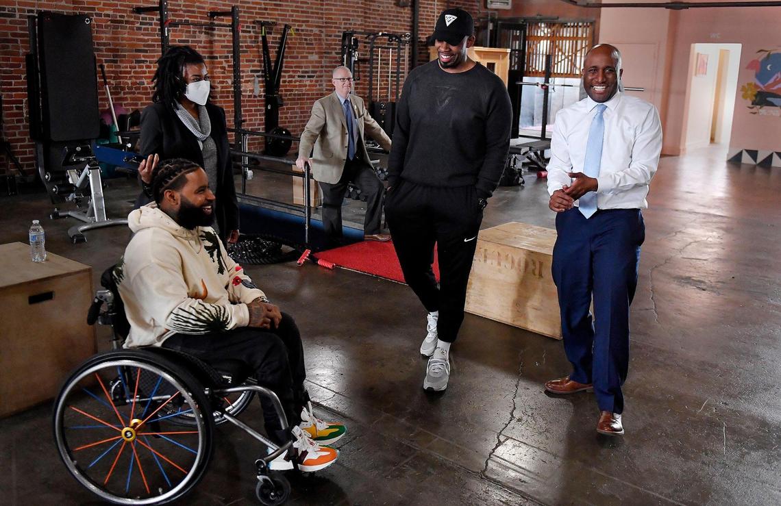 To honor Black History Month, Kansas City mayor Quinton Lucas, right, went on a tour Friday, recognizing some of Kansas City’s black businesses that specialize in health and wellness. At each stop, Lucas presented them with a proclamation of gratitude for their service. In the east Crossroads district, Lucas stopped to chat with Wesley Hamilton, left, of Disabled But Not Really, and Jabari Washington, who owns The TUF Club. Both businesses are in the same space where they work with clients to strengthen their mental and physical performance.