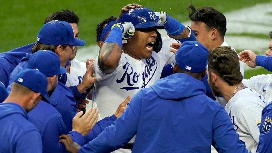 Kansas City Royals’ Salvador Perez, center, celebrates with teammates after hitting a walkoff home run during the seventh inning of the second baseball game of the team’s doubleheader against the Toronto Blue Jays on Saturday, April 17, 2021, in Kansas City, Mo. The Royals won 3-2. (AP Photo/Charlie Riedel)