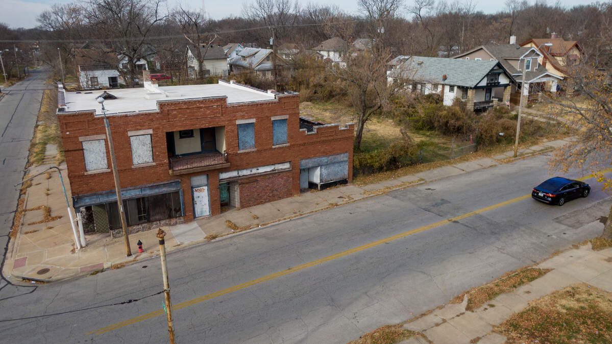 Developers want to convert a dilapidated brick building at 36th Street and Indiana Avenue into a neighborhood resource and cultural center that would include four retail spaces and three apartments.