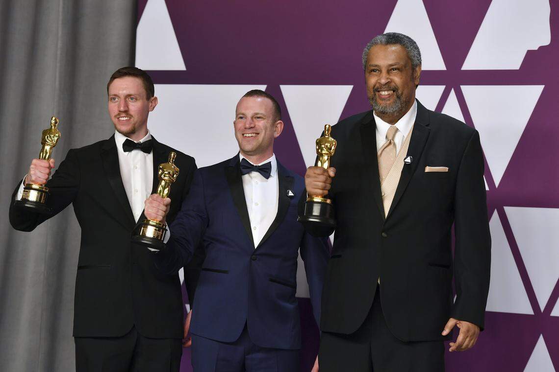 Backstage at the Academy Awards, writers David Rabinowitz (from left), Charlie Wachtel and Kevin Willmott show off their Oscars for “BlacKkKlansman.”