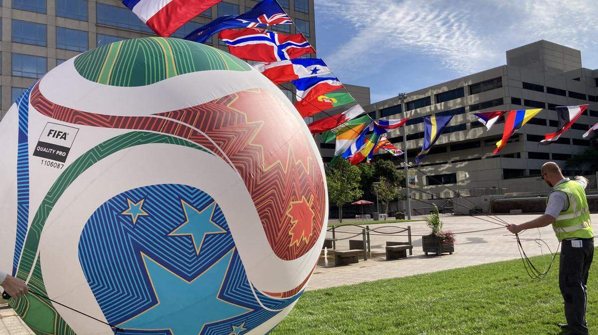 A crew at Crown Center secured a giant soccer ball on the shopping center’s plaza on Wednesday, May 20.