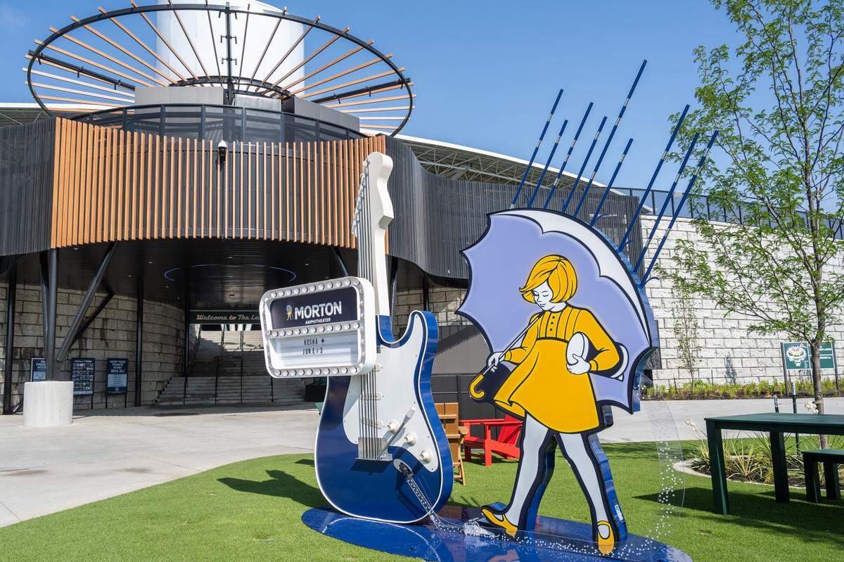 The Morton Salt girl next to a sign showcasing the musical act, inside Morton Amphitheater, the Kansas City area's newest music venue, on Monday, June 1st, 2026, in Riverside. The Vinyl Room features a bar, food service, and an outdoor seating area.