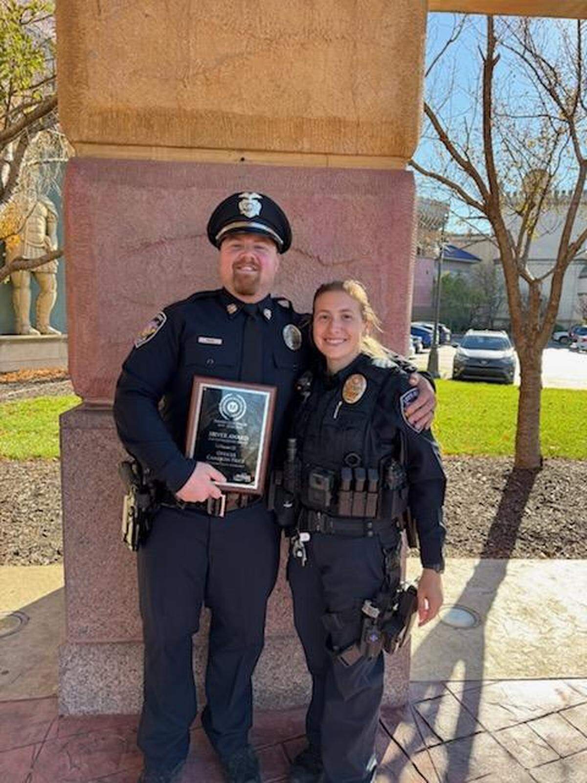 Cameron Price and his wife, Sydni Beeman-Price, are pictured side by side. Cameron’s awards are the Silver Award for Valor from the Metropolitan Chiefs and Sheriffs Association (given to Cameron in response to the case and his actions).