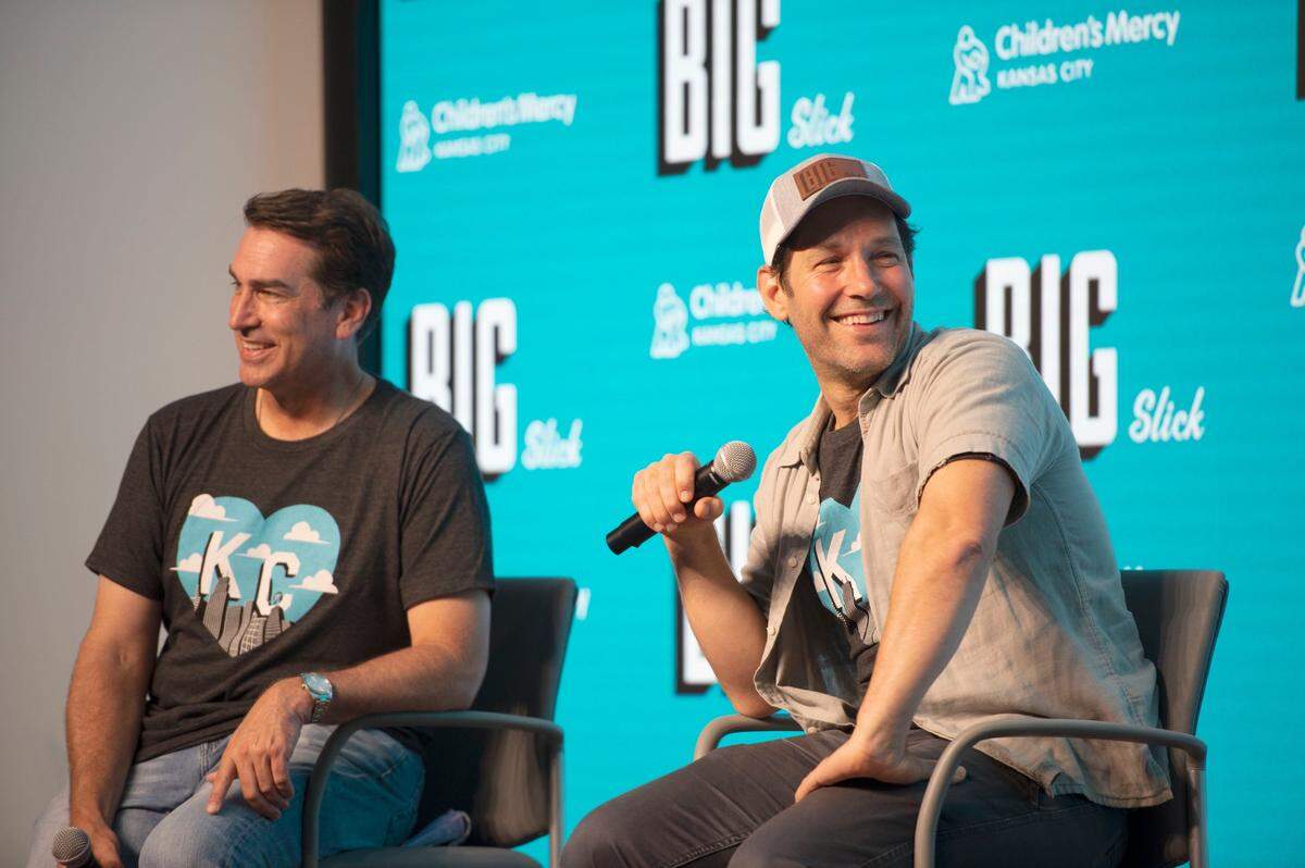 Rob Riggle, left, and Paul Rudd speak during a press conference for Big Slick at Children’s Mercy Hospital in 2022.