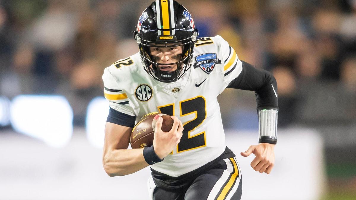 Missouri quarterback Brady Cook (12) scrambles up the field during the Lockheed Martin Armed Forces Bowl game between the Army Black Knights and the Missouri Tigers on Wednesday December 22, 2021 in Fort Worth, Texas.