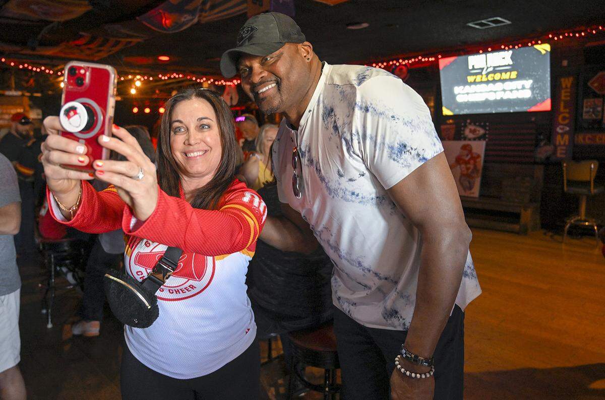 Natalie White, a former Kansas City Chiefs cheerleader, took a selfie with Neil Smith, the Chiefs defensive end, in 2023 at Pub Rock Live, a Chief’s bar in Scottsdale, Arizona. White was 17-years-old when she cheered for the Chiefs. White now lives in Las Vegas and traveled to Arizona for Super Bowl LVII.