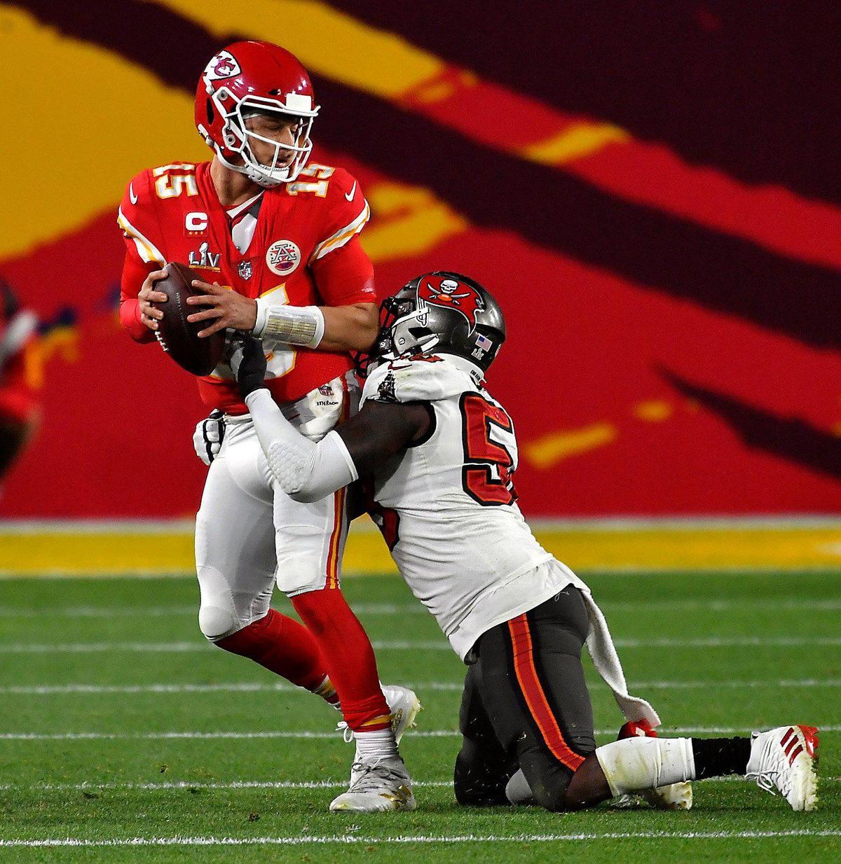 Kansas City Chiefs quarterback Patrick Mahomes found himself in the grasp of Tampa Bay Buccaneers outside linebacker Shaquil Barrett in the second half Sunday, February 7, 2021, at Super Bowl LV at Raymond James Stadium in Tampa, Florida.