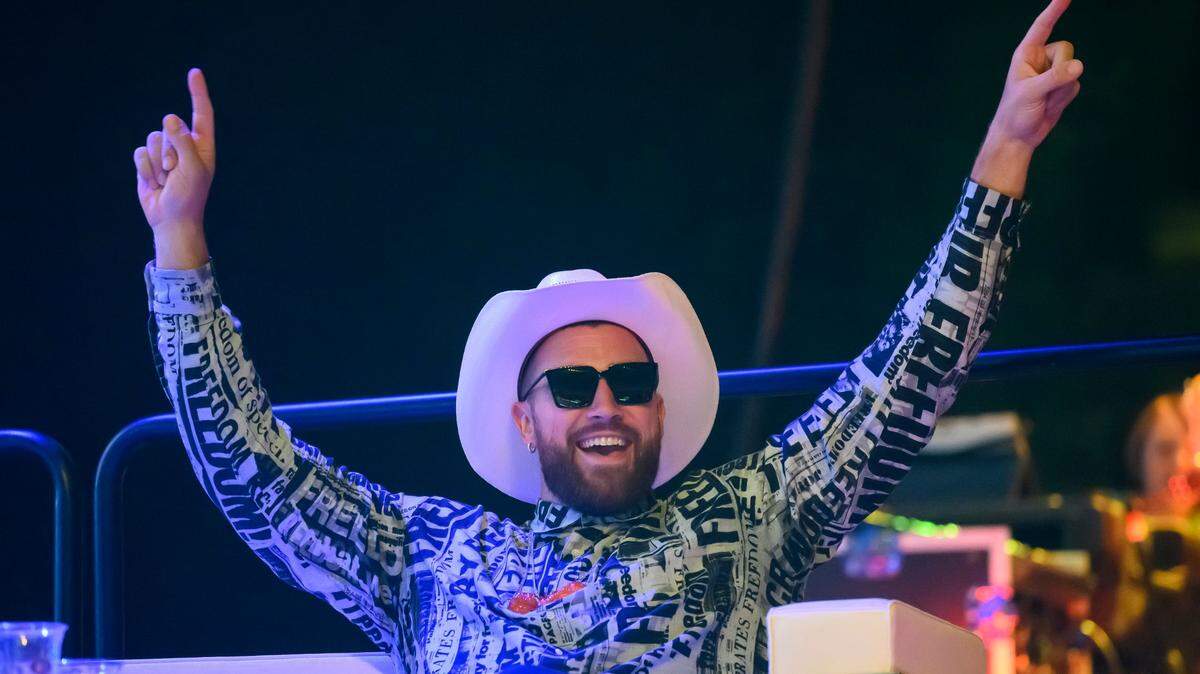 Travis Kelce celebrates a high bid during the Big Slick fundraiser in June. Taylor Swift fans have been dredging up the tight end’s old tweets.