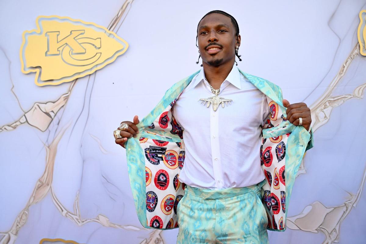 Kansas City Chiefs wide receiver Mecole Hardman shows off his jacket during the Kansas City Chiefs Super Bowl LVIII Championship ring ceremony red carpet event.