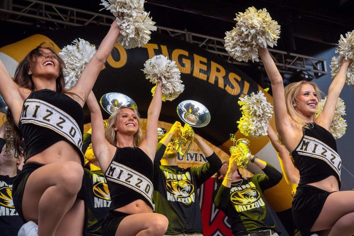 The Mizzou Spirit Squad dances on stage at the Mizzou Spirit Rally at Ballpark Village on Friday, March 20, 2026, in St. Louis. The Missouri Tigers faced off against the Miami Hurricanes in the first round of the NCAA Men's Basketball Tournament in St. Louis.