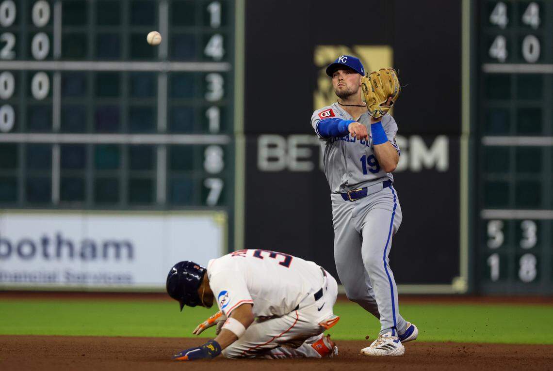 Kansas City Royals second baseman Michael Massey (19) turns a double play against Houston Astros shortstop Jeremy Pena (3) and Houston Astros left fielder Jose Altuve (not pictured) in the fourth inning at  Daikin Park on May 14, 2025 in Houston, Texas, USA.  