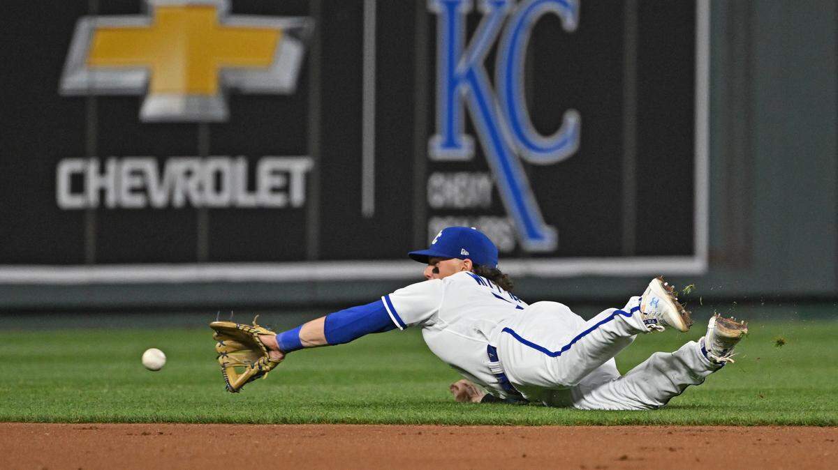 Kansas City Royals shortstop Bobby Witt Jr. (7) makes a diving play on a ground ball during the fifth inning against the Chicago White Sox at Kauffman Stadium on May 9, 2023.