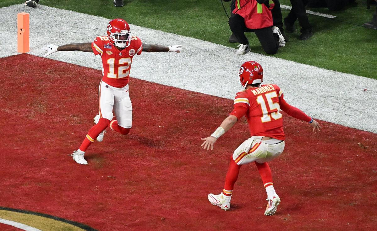 Kansas City Chiefs quarterback Patrick Mahomes (15) runs for wide receiver Mecole Hardman Jr. (12) after Hartman caught the game-winning touchdown reception in overtime to defeat the San Francisco 49ers in Super Bowl LVIII, Sunday, Feb. 11, 2024, in Las Vegas.