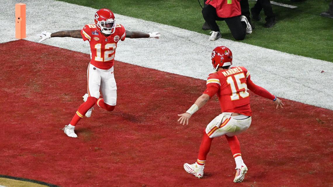 Kansas City Chiefs quarterback Patrick Mahomes (15) runs for wide receiver Mecole Hardman Jr. (12) after Hartman caught the game-winning touchdown reception in overtime to defeat the San Francisco 49ers in Super Bowl LVIII, Sunday, Feb. 11, 2024, in Las Vegas.