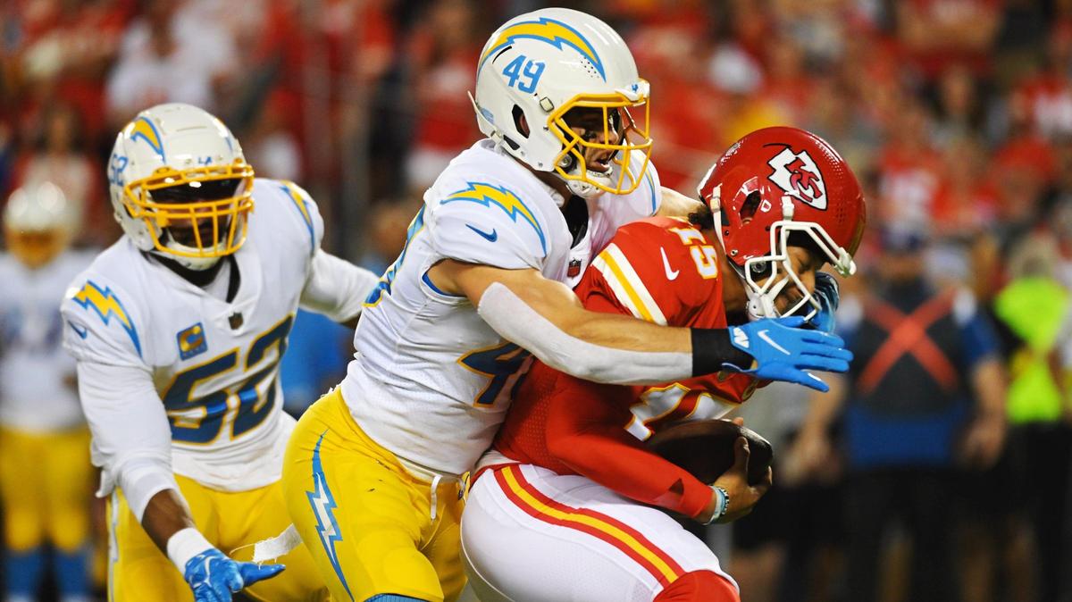 Kansas City Chiefs quarterback Patrick Mahomes is sacked by Los Angeles Chargers linebacker Drue Tranquill in the first quarter Thursday, September 15, 2022, at Arrowhead Stadium.