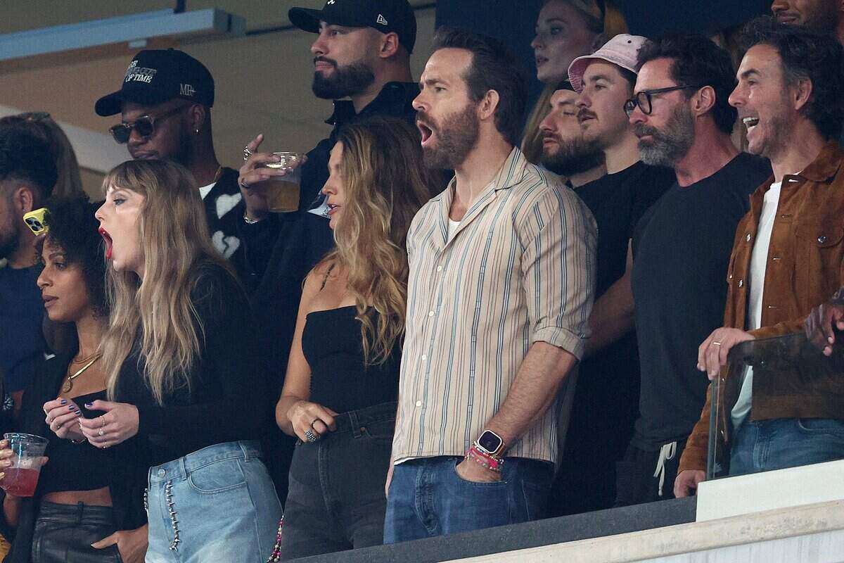 Left to right,Taylor Swift, Ryan Reynolds and Hugh Jackman cheer at the game between the Kansas City Chiefs and the New York Jets at MetLife Stadium on October 01, 2023 in East Rutherford, New Jersey.
