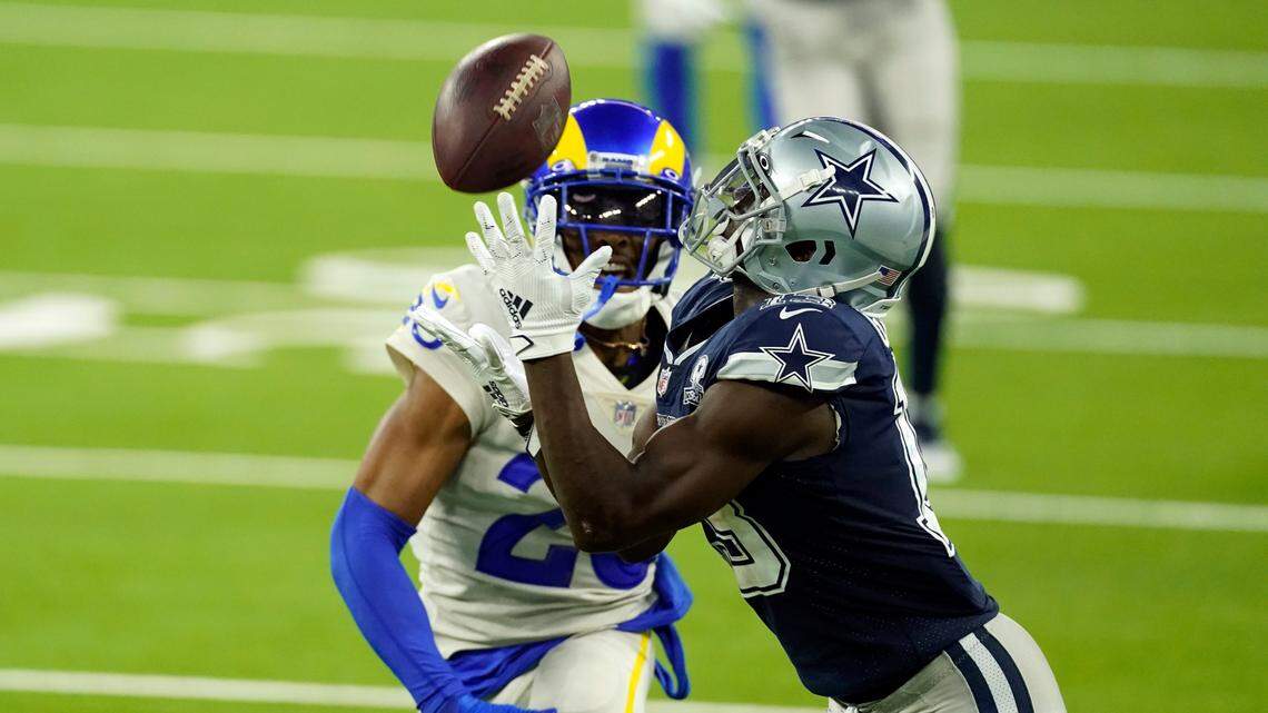 Dallas Cowboys wide receiver Michael Gallup, right, makes a catch but is called for offensive pass interference on Los Angeles Rams’ Jalen Ramsey during the second half of an NFL football game Sunday, Sept. 13, 2020, in Inglewood, Calif. (AP Photo/Ashley Landis)