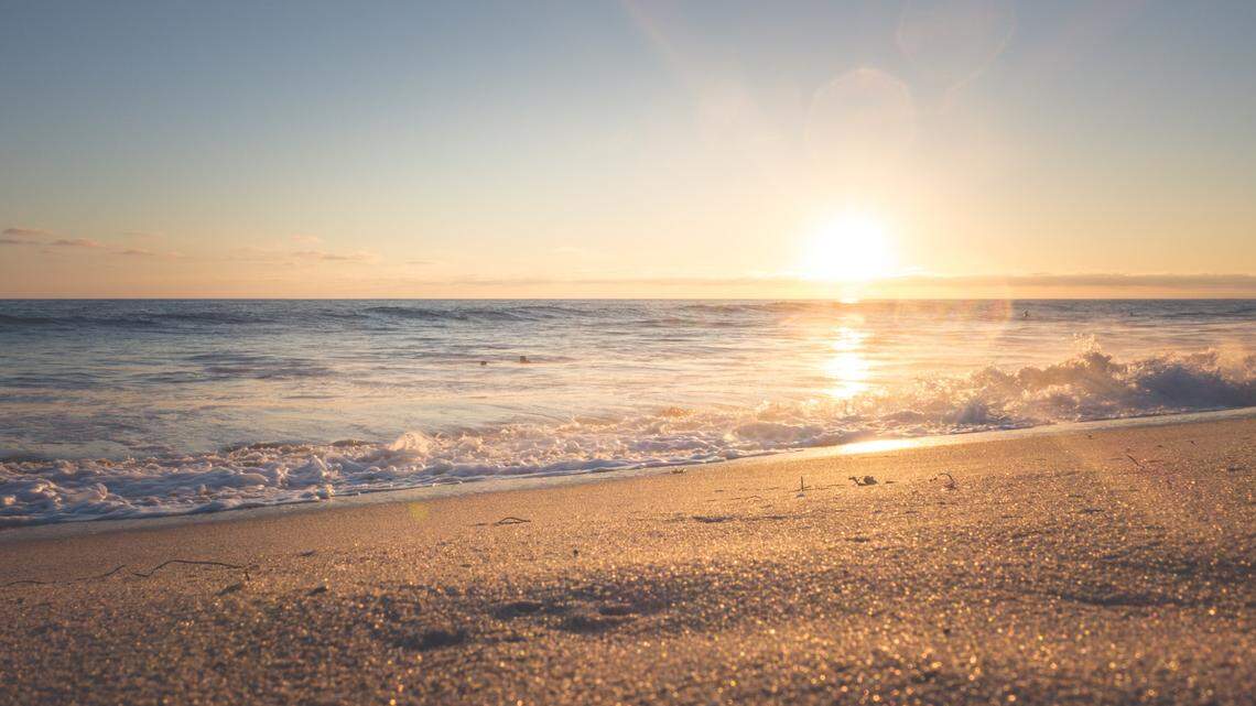 File photo of a beach. A Michigan man was sitting on a beach when he realized he won a $150,000 Powerball prize, according to lottery officials.