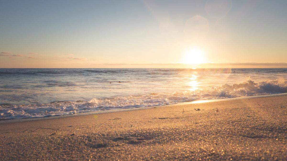 File photo of a beach. A Michigan man was sitting on a beach when he realized he won a $150,000 Powerball prize, according to lottery officials.