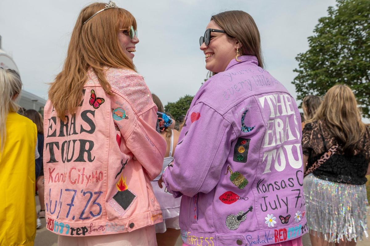 Dana Szczecina, left, and her sister Sara Szczecina are seen wearing jean jackets depicting Taylor Swift music eras while attending Taylor Swift’s Eras Tour at GEHA Field at Arrowhead Stadium on Friday, July 7, 2023, in Kansas City.