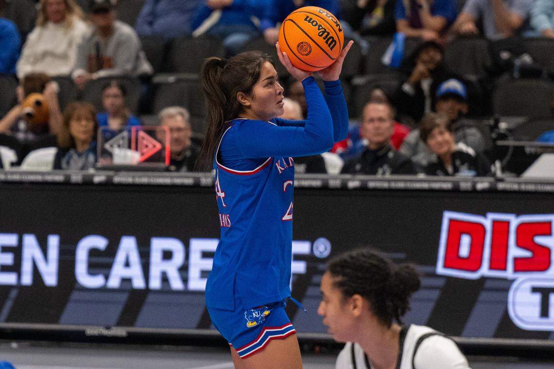 Kansas Jayhawks forward Regan Williams (24) shoots a 3-pointer during the second half of KU’s second-round game at the Big 12 Women's Basketball Tournament on Thursday, March 5, 2026, at T-Mobile Center in Kansas City.