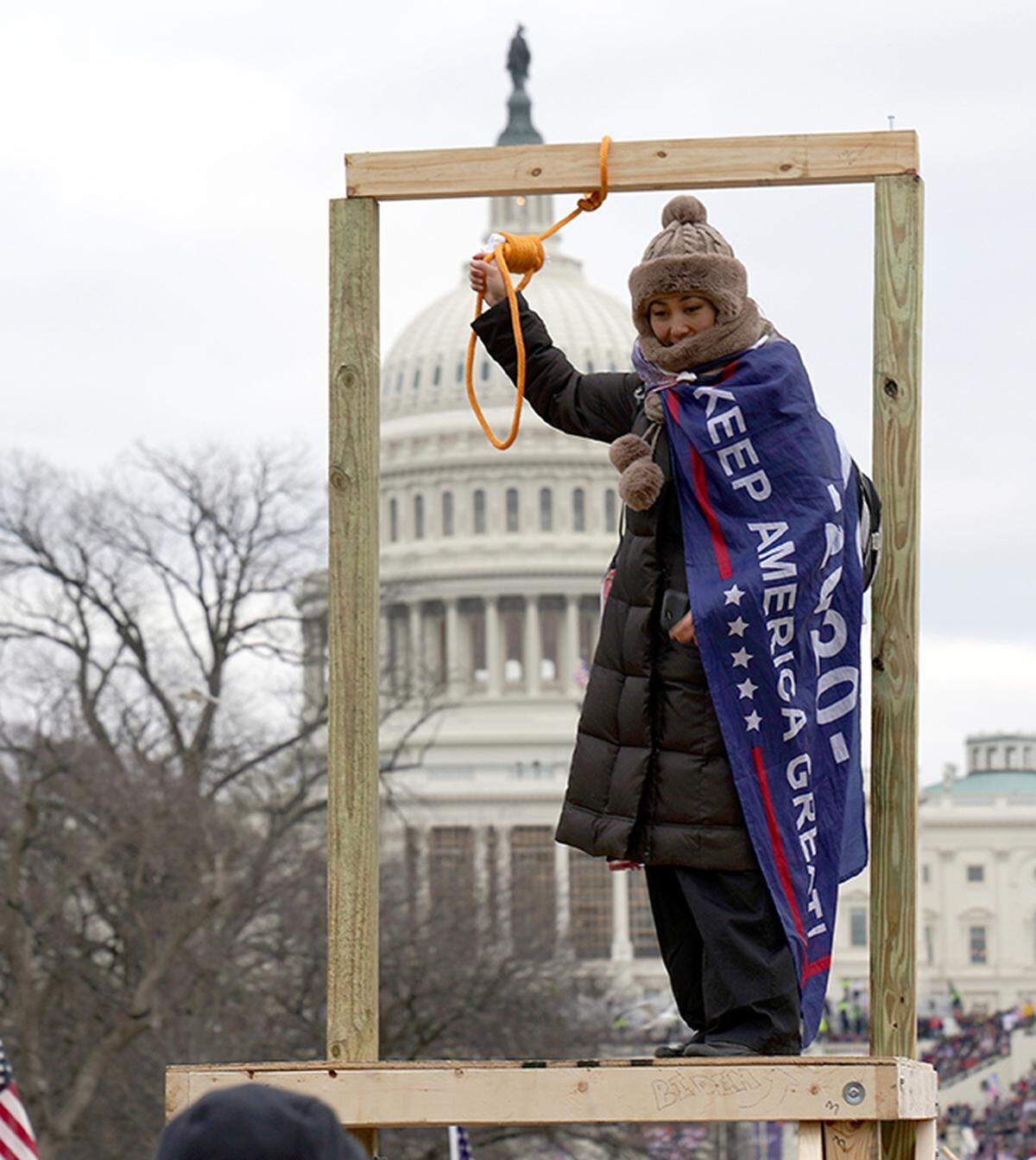 Jan 6, 2021; Washington, DC, USA; A person holds up a noose displayed in front of the U.S. Capitol building on Jan. 6, 2021. Mandatory Credit: Trevor Hughes-USA TODAY