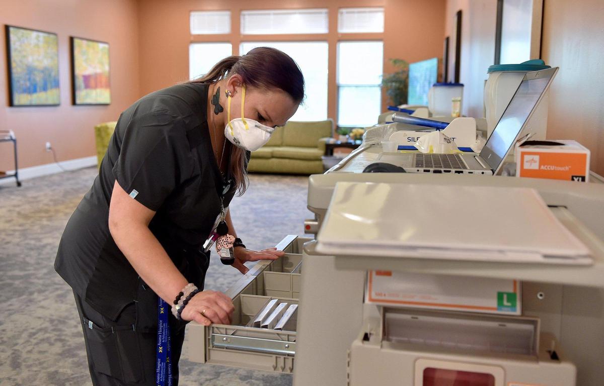 Jillian Winkler, a nurse at Northland Rehabilitation & Health Care, prepares medication Thursday, May 20, 2021. Nursing homes are facing a dire financial situation and potentially closure if a key tax that funds Medicaid and pays hospitals and nursing homes is not renewed.
