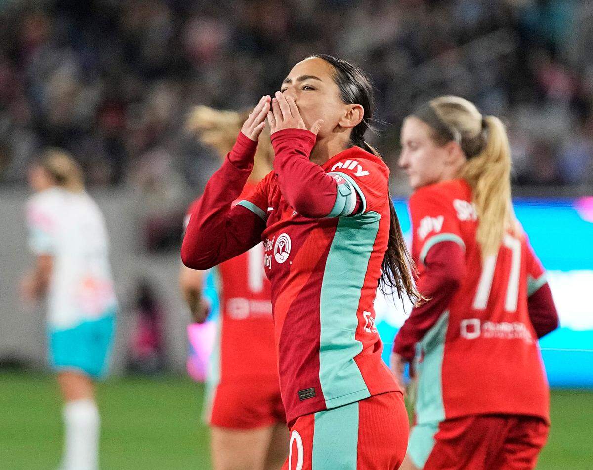 Kansas City Current midfielder Lo’eau LaBonta (10) celebrates with teammates after scoring a goal during the second half against the San Diego Wave FC at Snapdragon Stadium on March 24, 2024.
