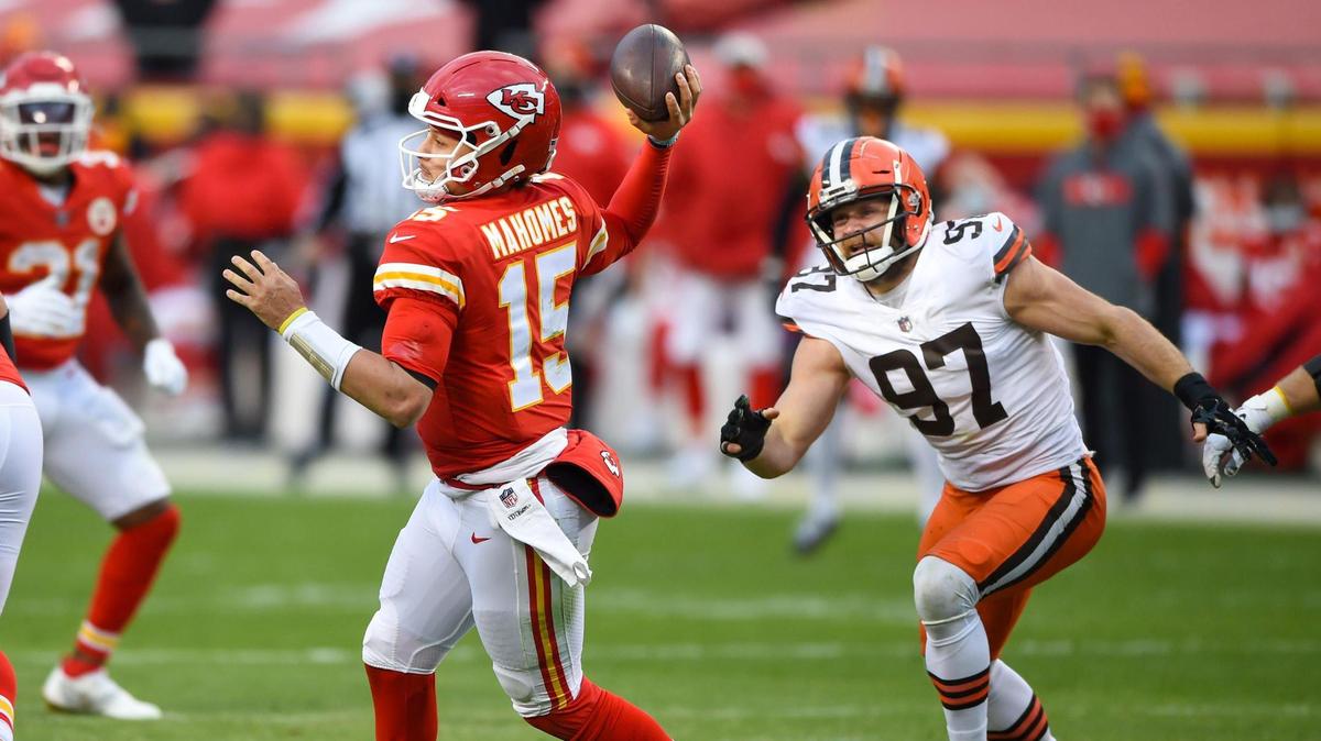 Kansas City Chiefs quarterback Patrick Mahomes (15) gets a pass off despite being rushed by Cleveland Browns defensive end Porter Gustin (97) in the second-half of the AFC divisional playoff game Sunday, Jan. 17, 2021 at Arrowhead Stadium. The Chiefs held on to win, 22-17.
