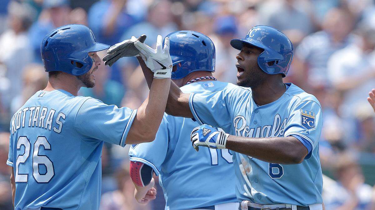 Kansas City Royals’ Lorenzo Cain (6) celebrates his grand slam in the sixth inning with George Kottaras (26) Billy Butler (16) and Eric Hosmer (35) during Thursday’s baseball game against the Cleveland Indians on July 4, 2013, at Kauffman Stadium in Kansas City, Mo. John Sleezer/The Kansas City Star