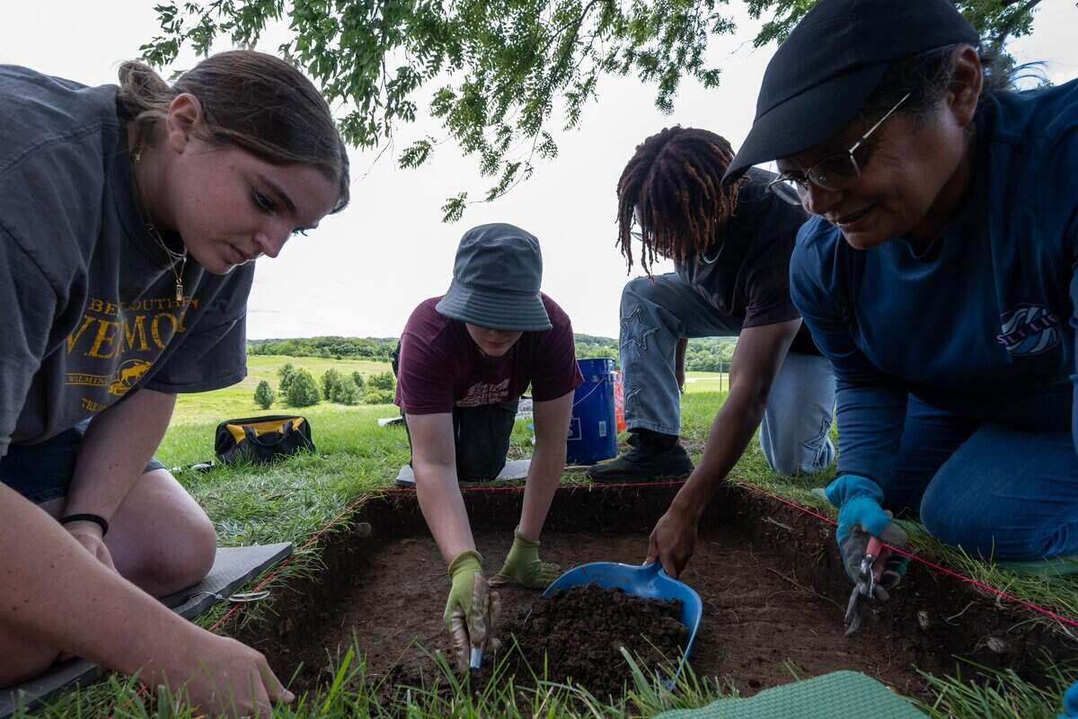 Students dig in the area of The Historic Halfway House Cellar on Tuesday, June 23, 2026, in Weston. Archaeologist Dr. Ann Raab instructs a class excavating a small area where the former Halfway House previously stood. The hope is to find artifacts or evidence of slavery on the grounds.