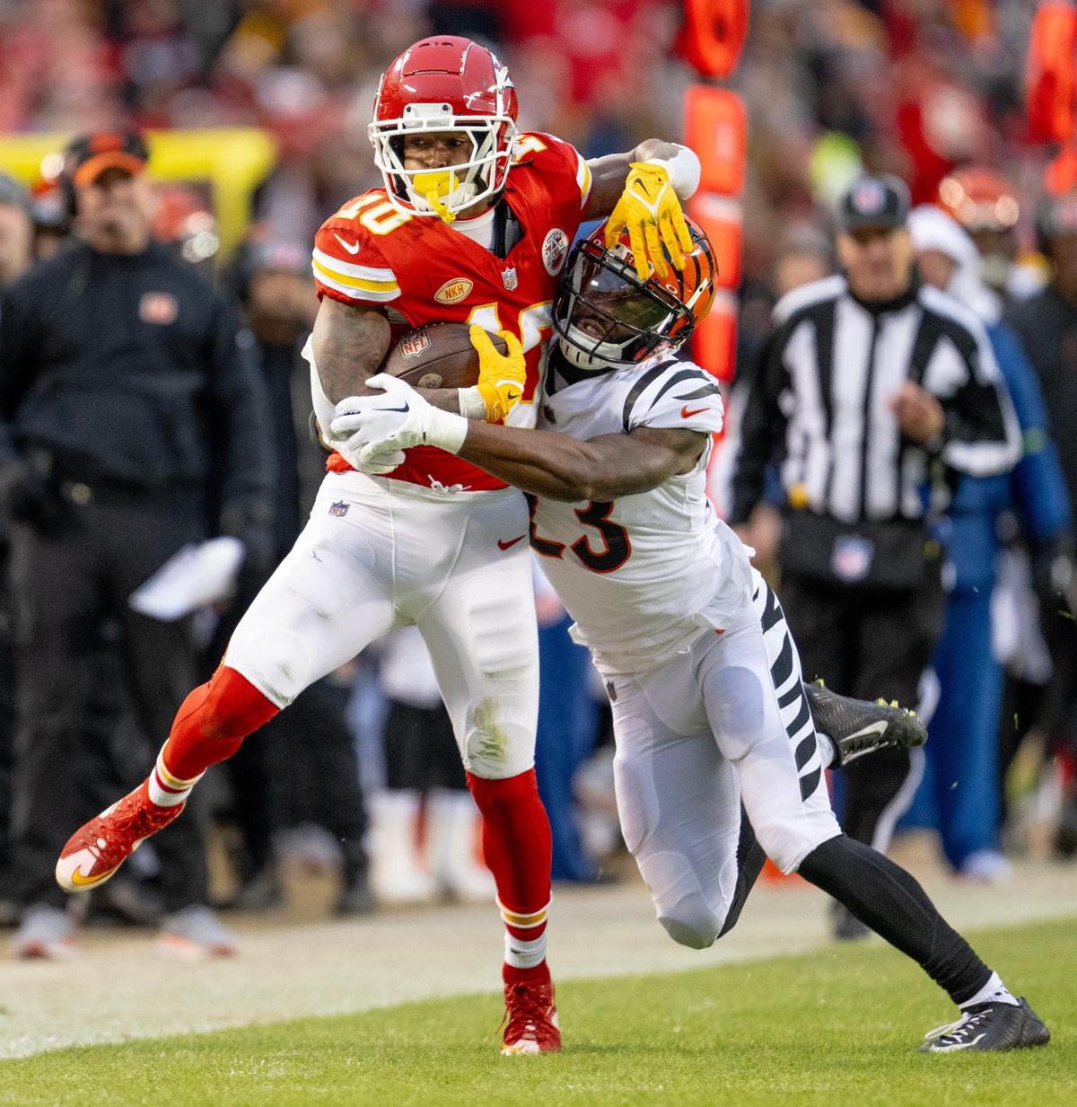 Chiefs running back Isiah Pacheco, left, pulls Cincinnati Bengals safety Dax Hill for a few extra yards during Sunday’s game at GEHA Field at Arrowhead Stadium.