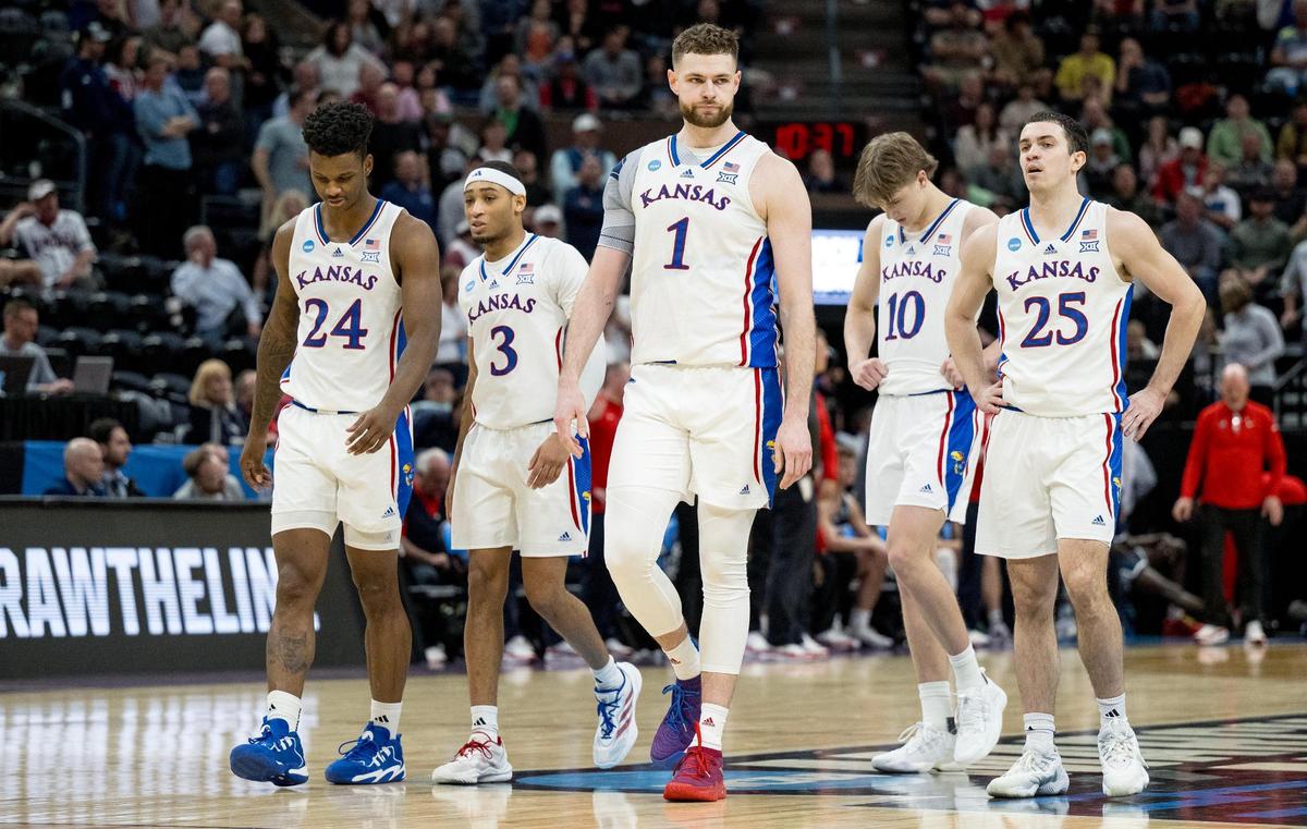Kansas Jayhawks forward K.J. Adams (24), guard Dajuan Harris Jr. (3), center Hunter Dickinson (1), guard Johnny Furphy (10) and guard Nicolas Timberlake (25) walk on the court during a men’s college basketball game against the Samford Bulldogs in the first round of the NCAA Tournament on Thursday, March 21, 2024, in Salt Lake City, Utah.