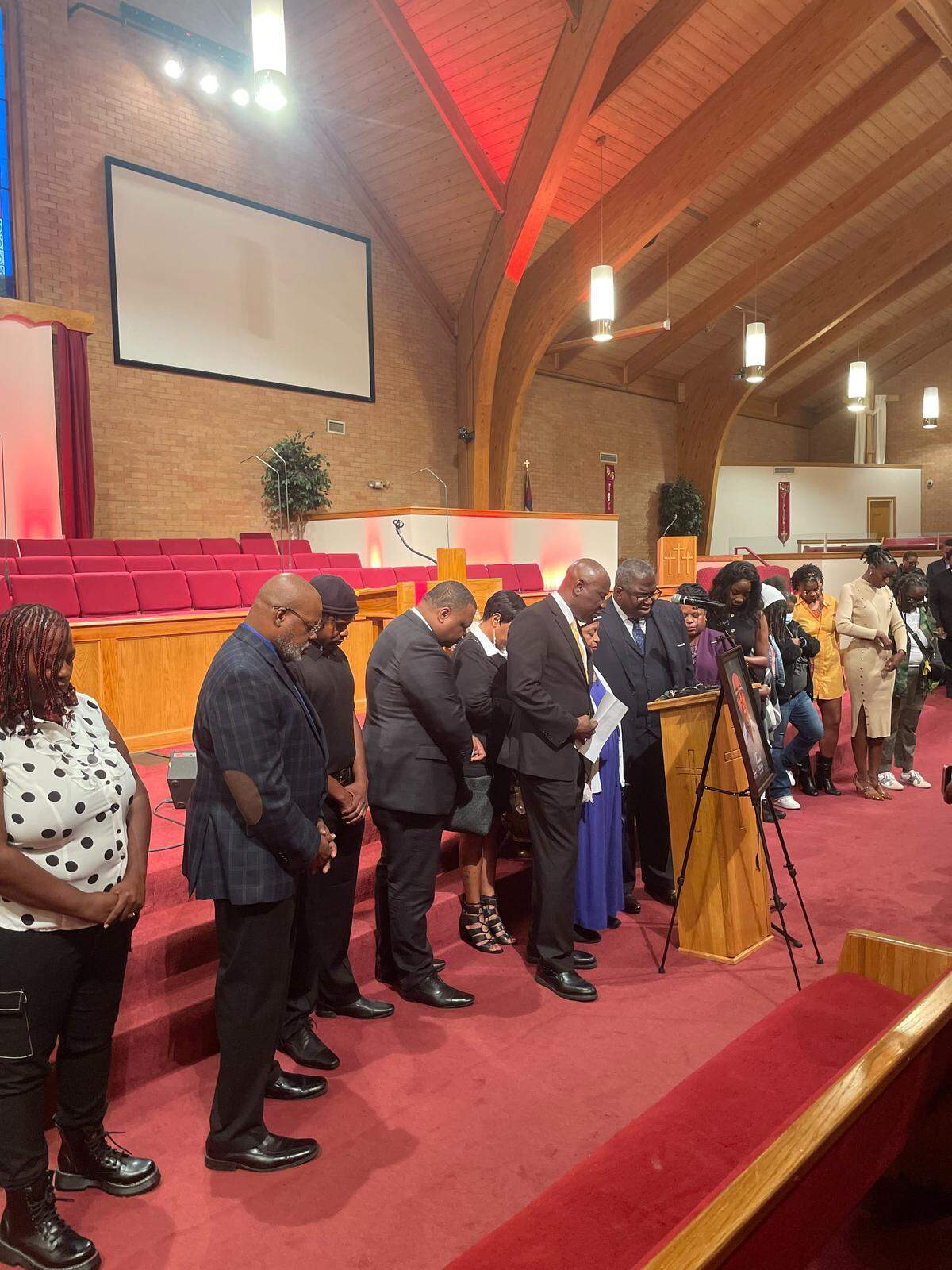Family members, loved ones, attorneys and advocates say a prayer in memory and in the pursuit of justice for the late Charles Adair at Friendship Baptist Church on Sept. 23, 2025.