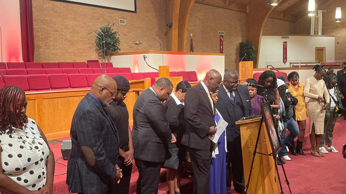 Family members, loved ones, attorneys and advocates say a prayer in memory and in the pursuit of justice for the late Charles Adair at Friendship Baptist Church on Sept. 23, 2025.