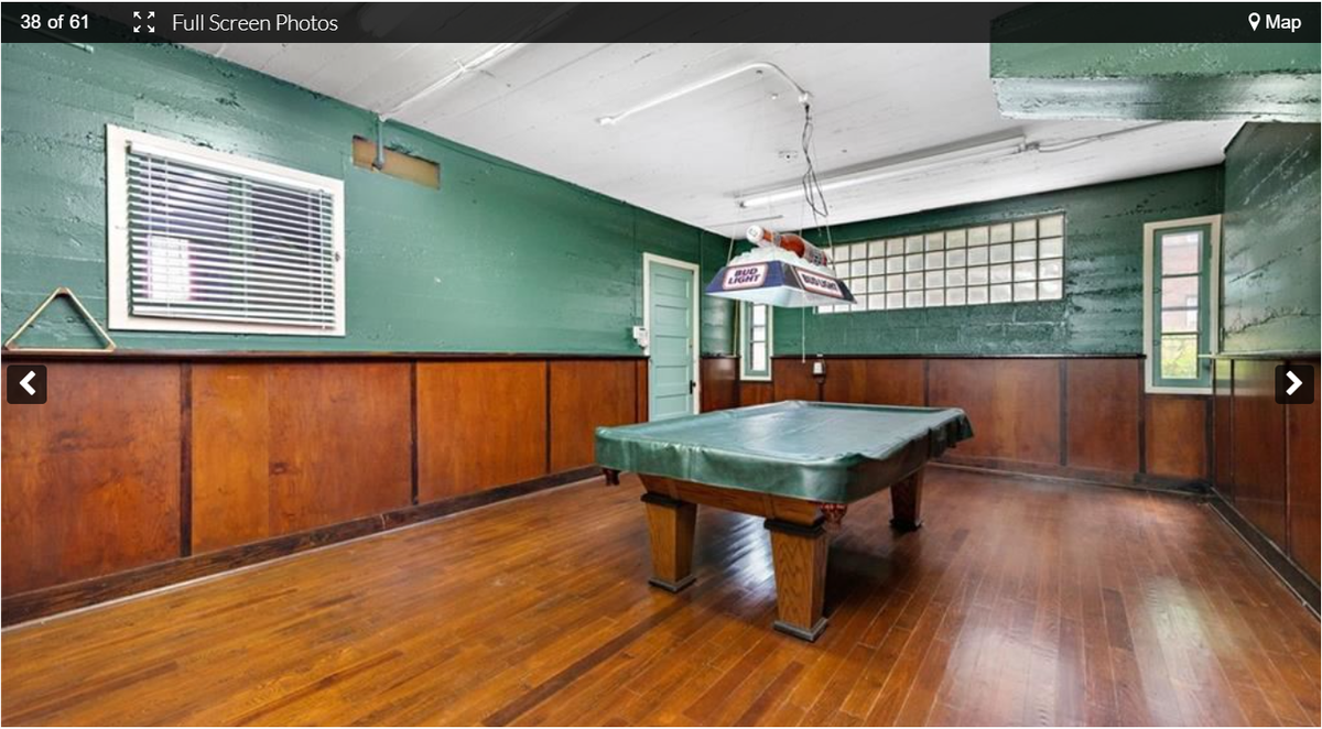 The basement billiards room at 3232 Windsor Ave. This historic home near the Kansas City Museum in the Northeast includes an indoor pool and a ship’s wheel. Screenshot from the Kansas City Regional Association of Realtors website. Feb. 9, 2024.