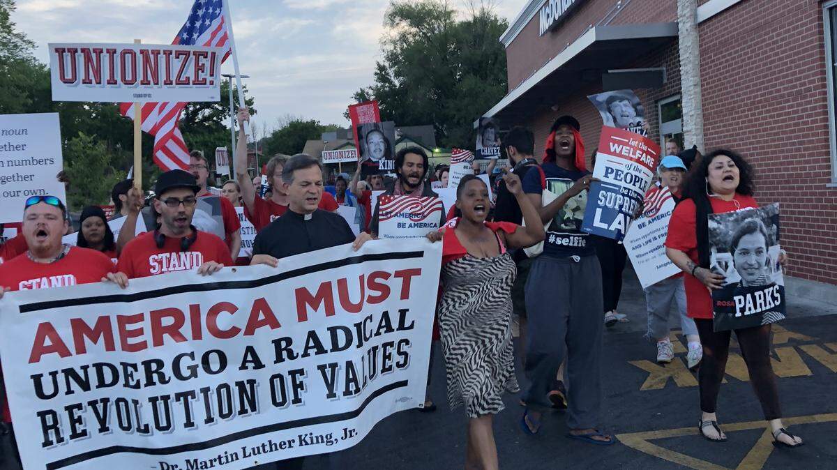 Protesters descended on fast food restaurants Monday on Emanuel Cleaver II Boulevard before leaving for Jefferson City, where the Missouri Poor People’s Campaign has protested for the past five Mondays.